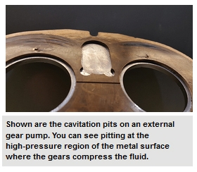 Shown are the cavitation pits on an external gear pump. You can see pitting at the high-pressure region of the metal surface where the gears compress the fluid.