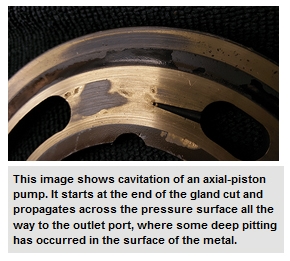 This image shows cavitation of an axial-piston pump. It starts at the end of the gland cut and propagates across the pressure surface all the way to the outlet port, where some deep pitting has occurred in the surface of the metal.